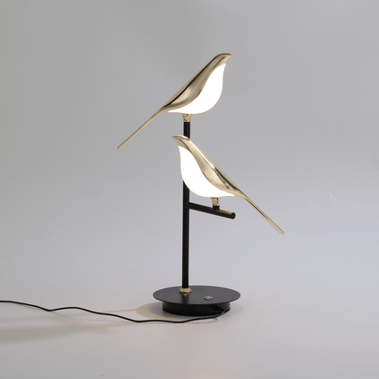 Aviara — Golden Vogel Tischlampe mit warmem Umgebungslicht
